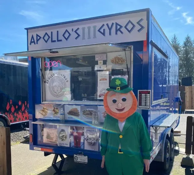 The blue Apollo’s Gyros truck with its window open